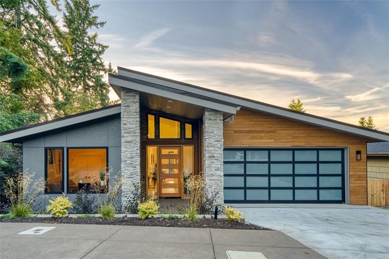 a front view of a house with a garage