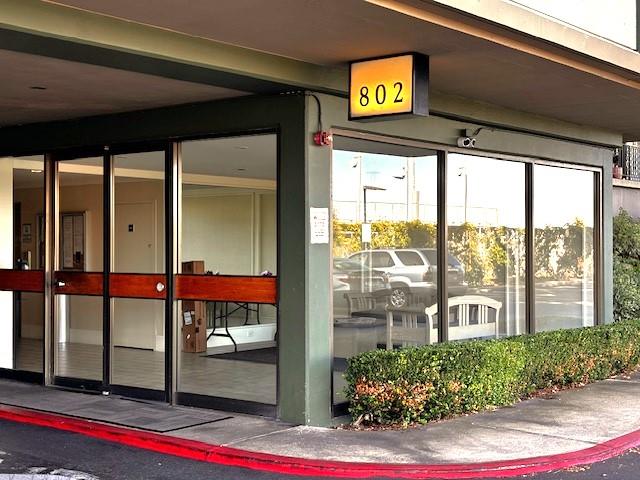 a view of an entryway with a floor to ceiling window