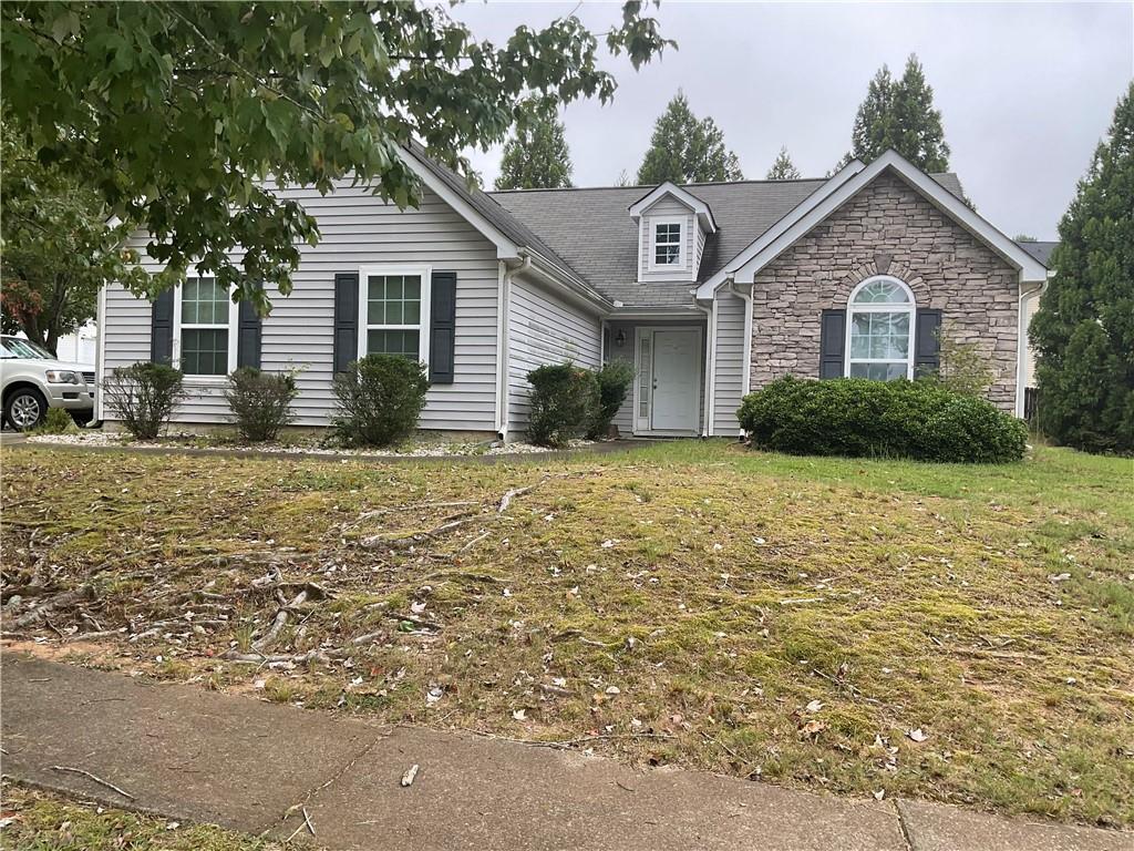 a front view of a house with garden