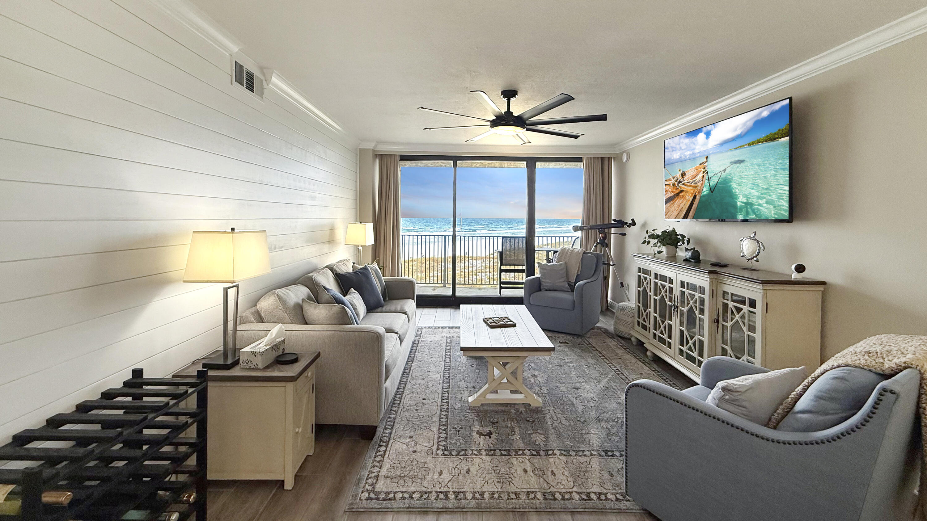 a living room with furniture and a flat screen tv