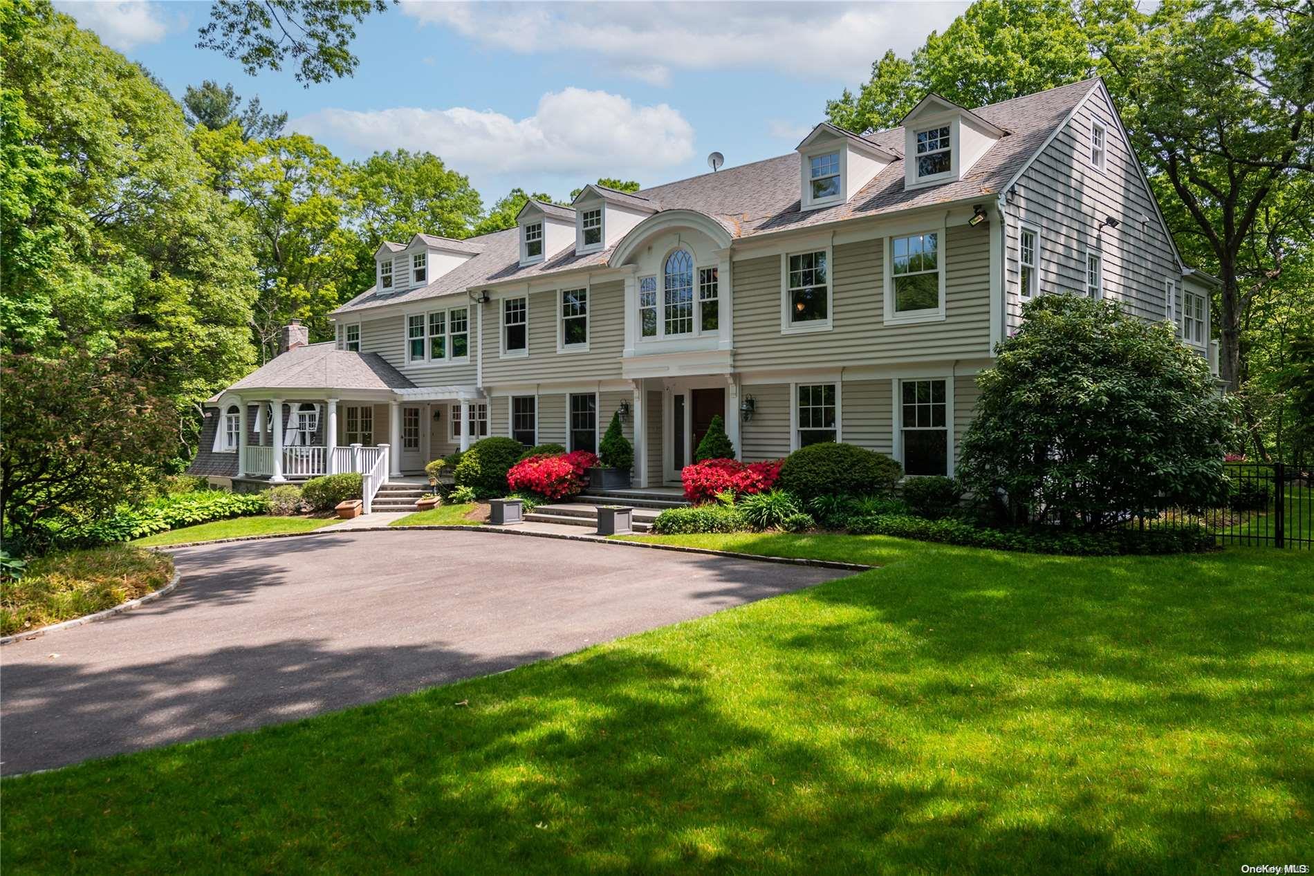 a front view of house with yard and outdoor seating