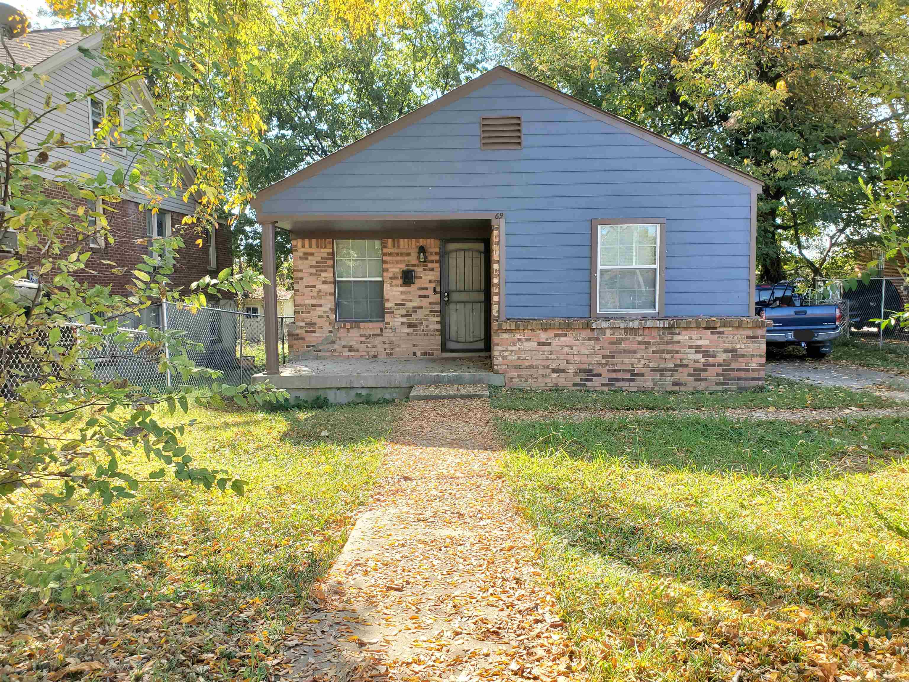 Bungalow-style home with a porch and a front lawn