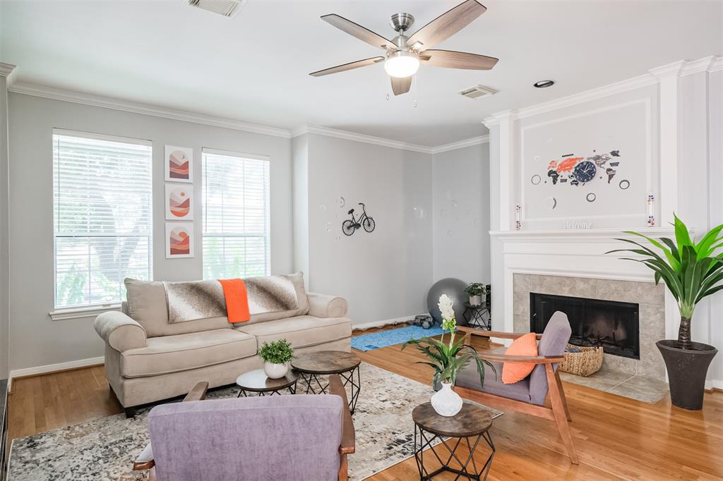 a living room with furniture and a fireplace