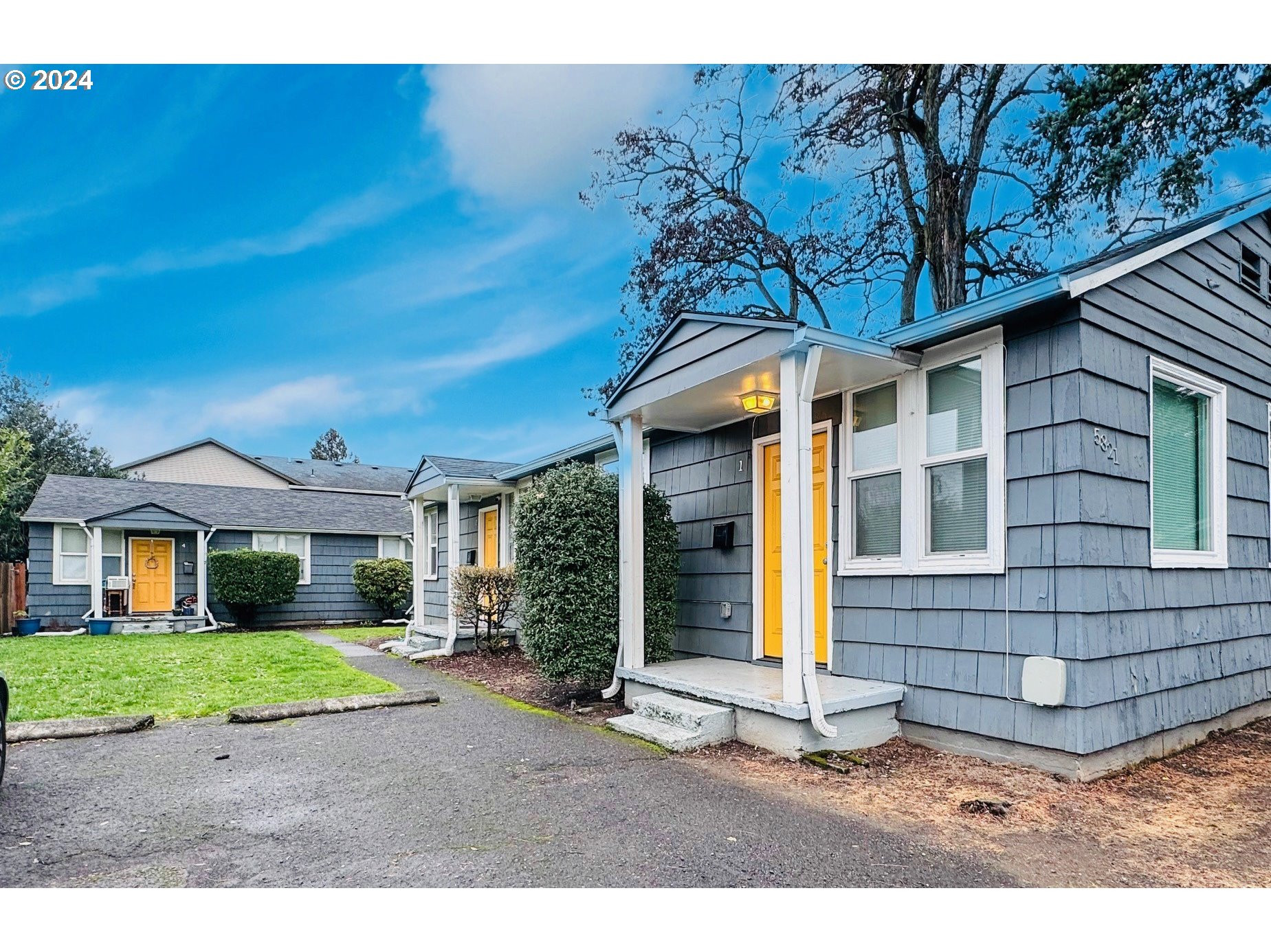 a front view of a house with a yard