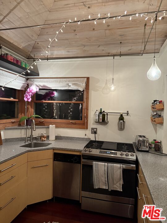 a kitchen with a stove and a sink