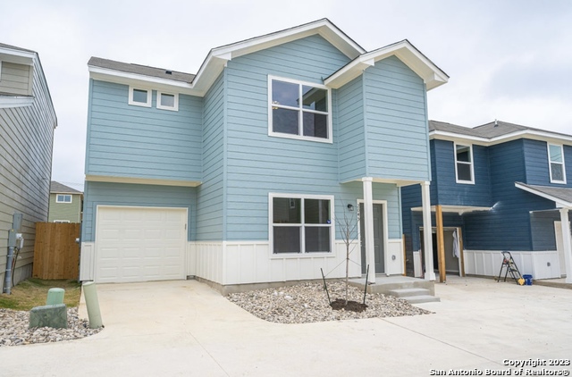 a front view of a house with a garage