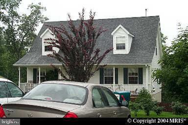 a view of house with outdoor space