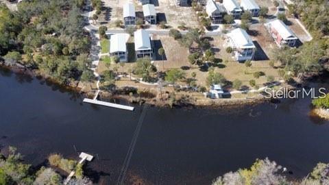 an aerial view of house with yard swimming pool and outdoor seating