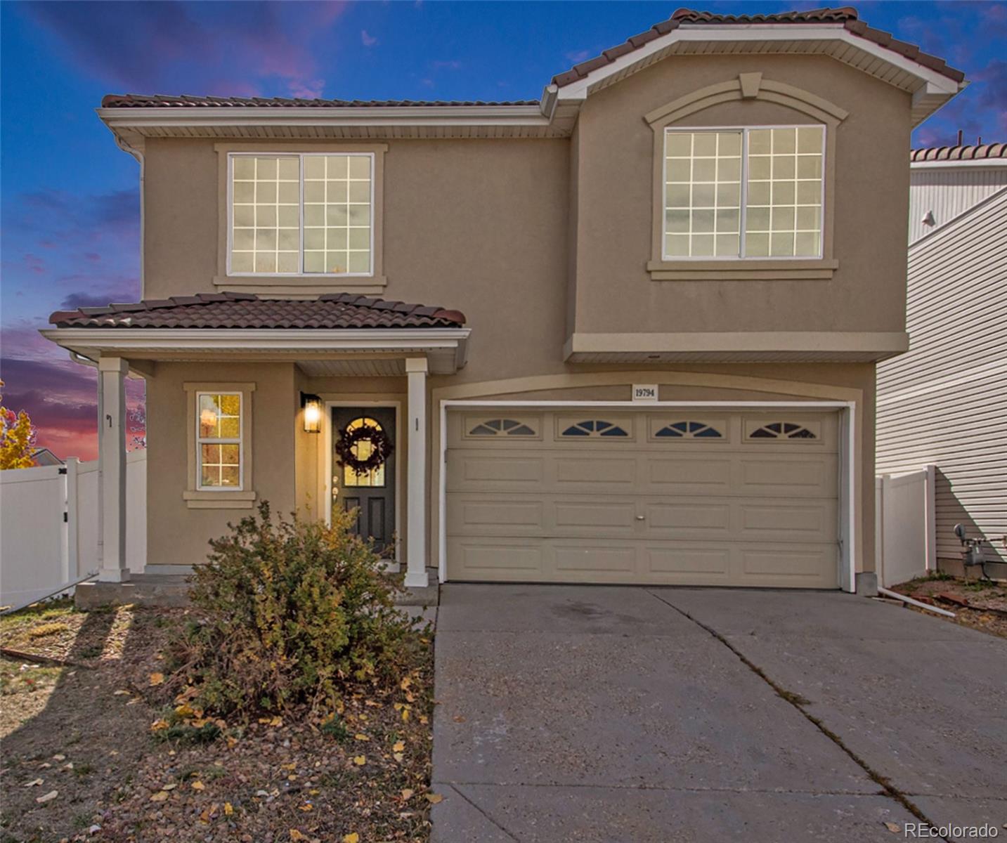 front view of a house with a garage