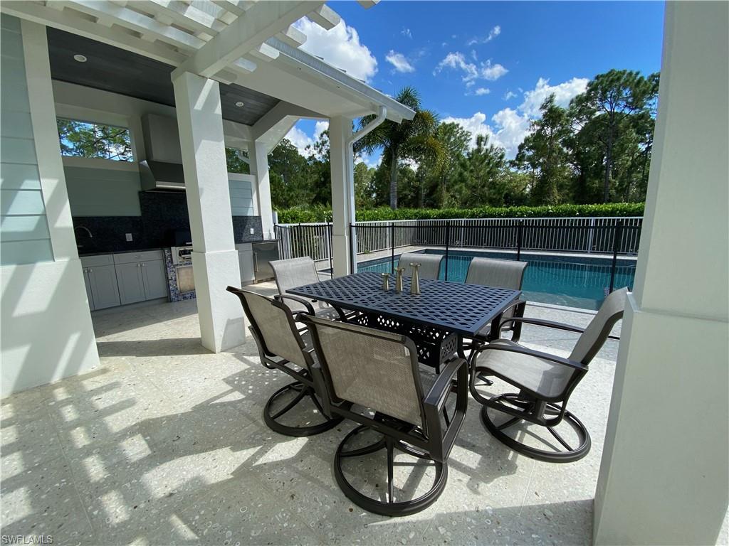 a view of a chairs and tables in patio