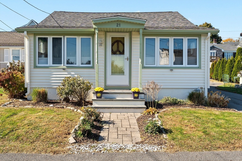 a front view of a house with a yard