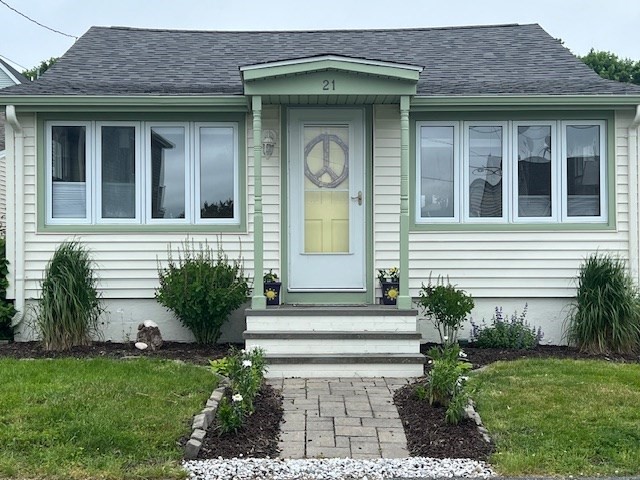 a front view of a house with garden