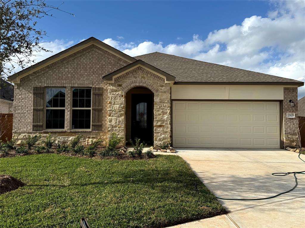 Welcome home to 2921 Cliff Ridge Lane located in the master planned community of Sunterra and zoned to Katy ISD.