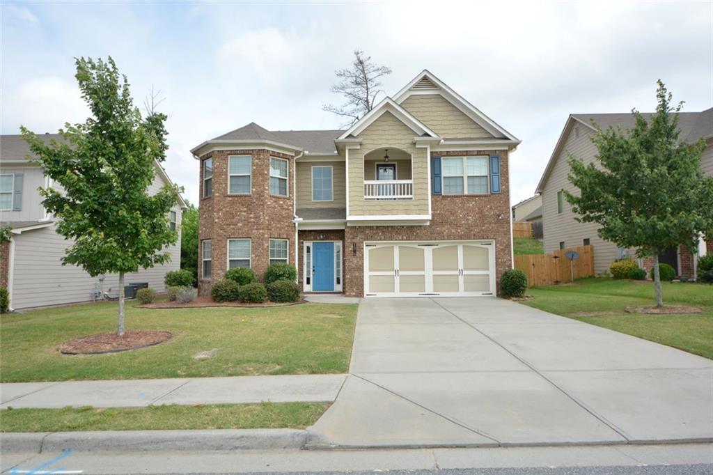 a front view of a house with a yard