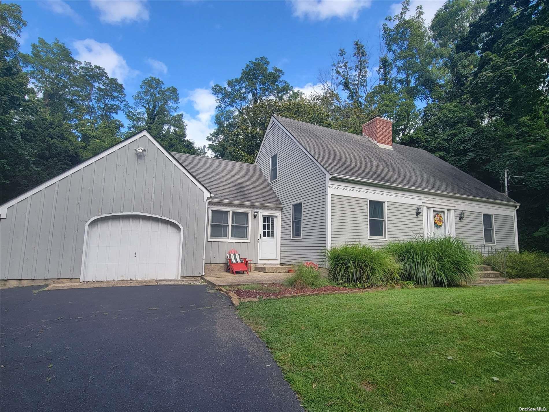 a view of front of house with a yard