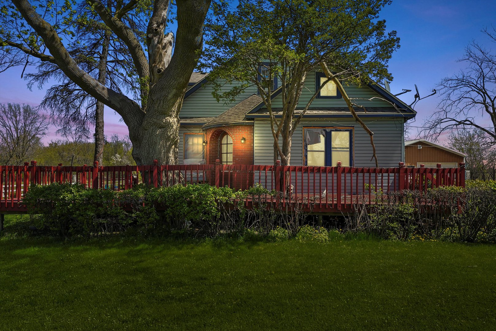 a front view of a house with garden