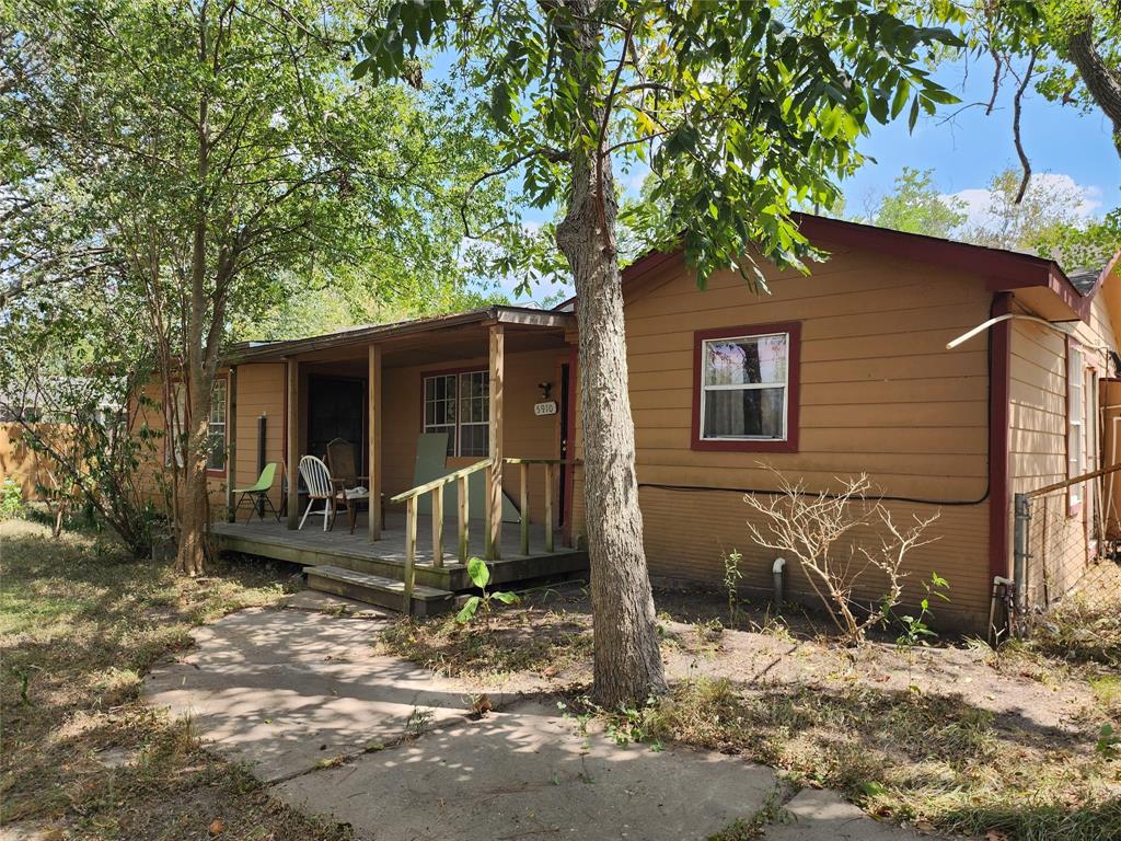 a house with trees in the background