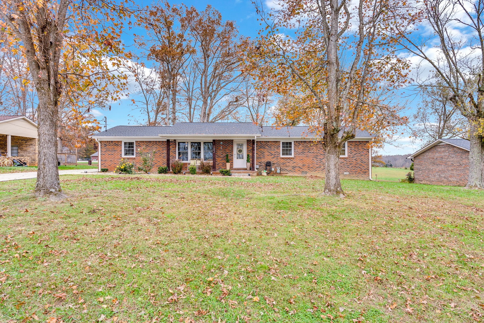 a front view of a house with a yard