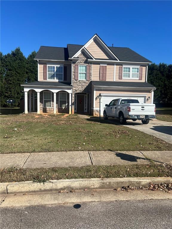 front view of a house with a yard