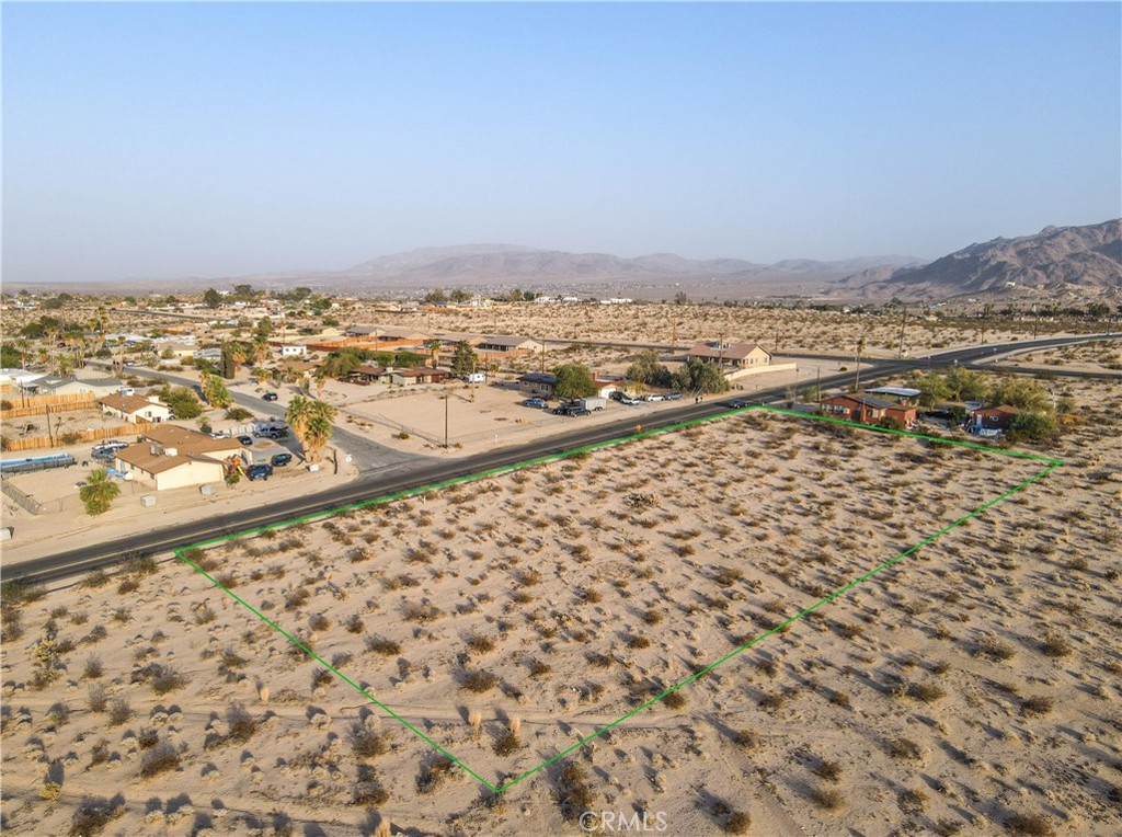 an aerial view of house with yard