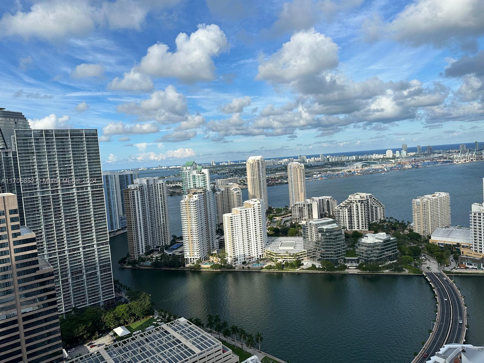 a view of a lake with tall buildings