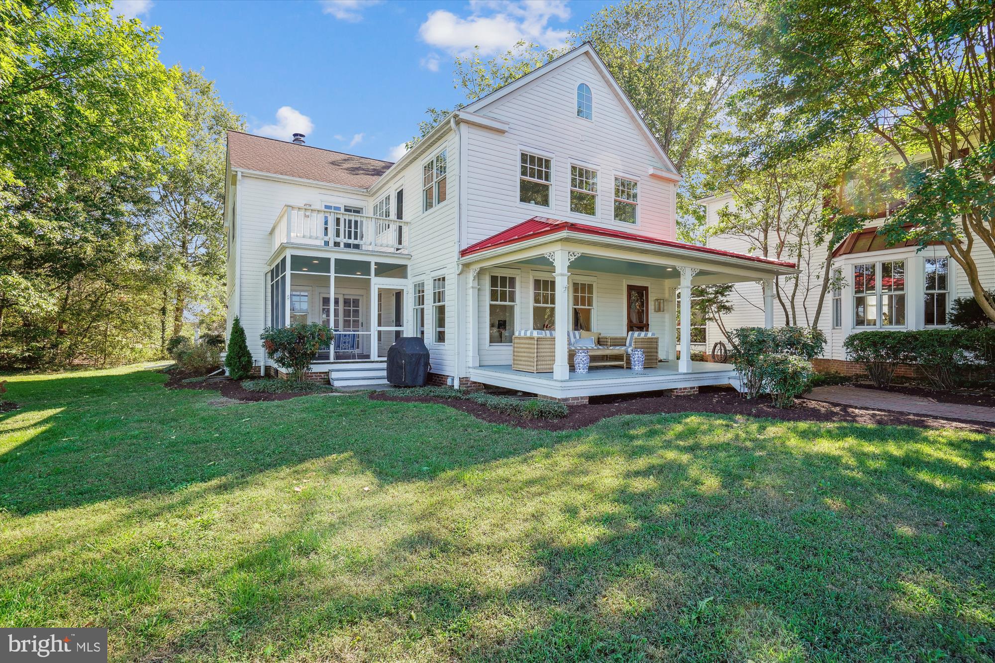 a view of a house with a yard porch and sitting area