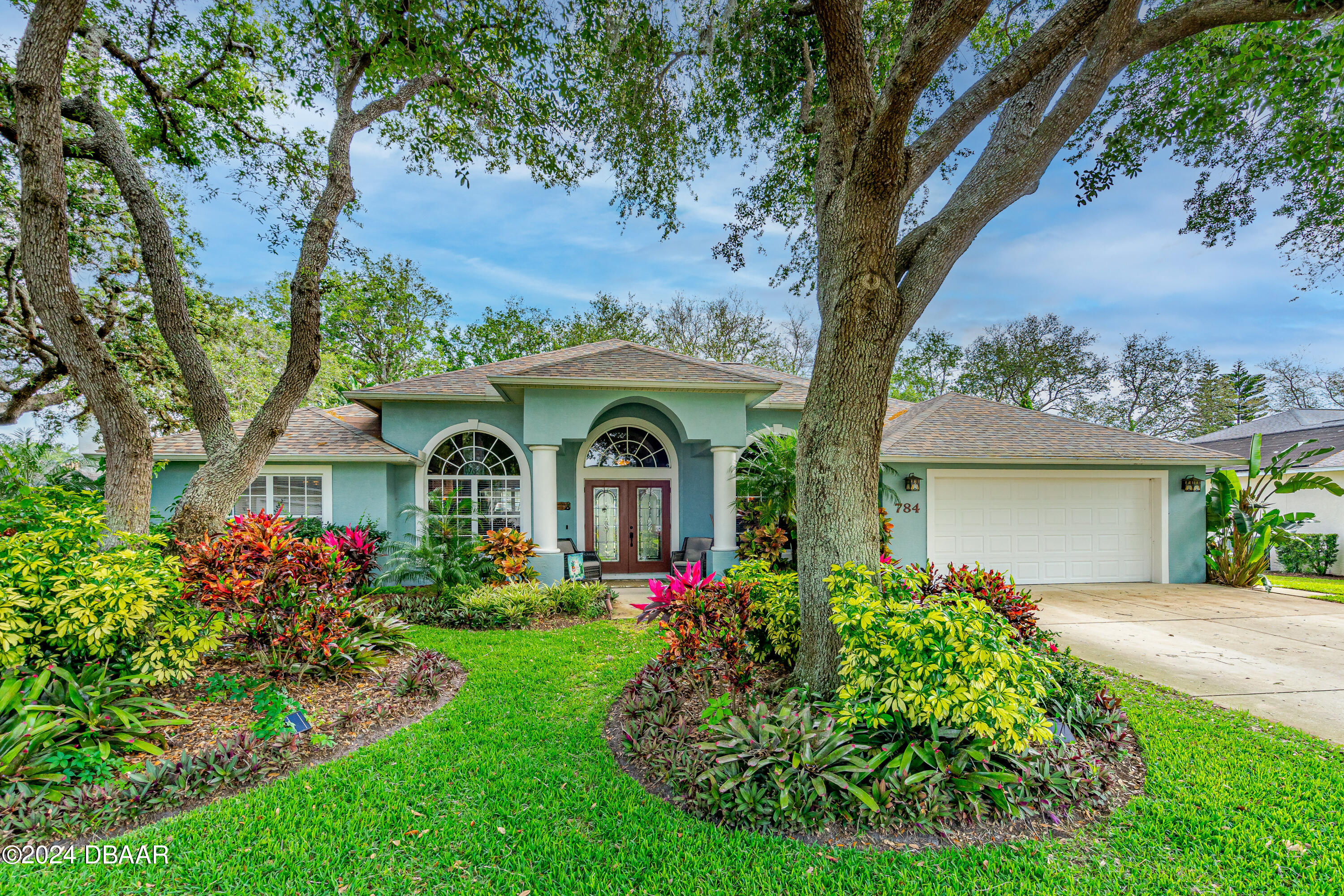 front view of a house with a yard