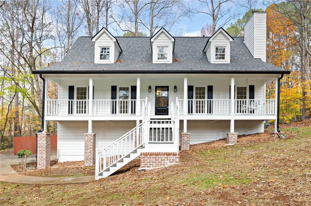 a front view of a house with a porch