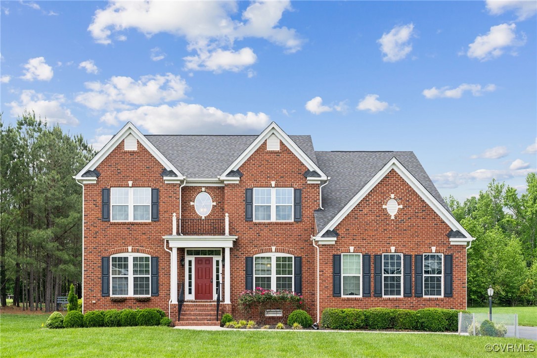 front view of a house next to a yard