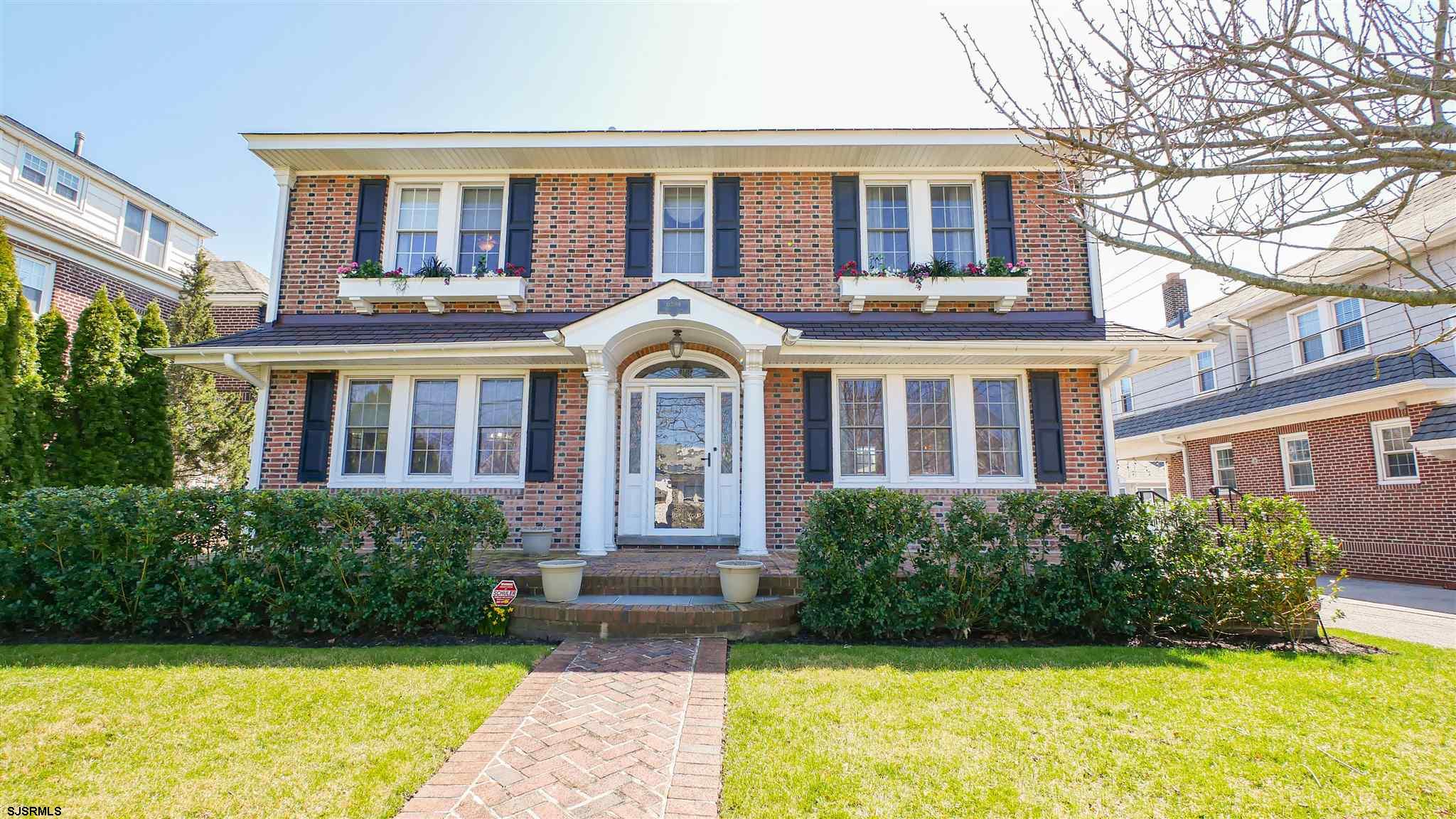 a front view of a house with yard