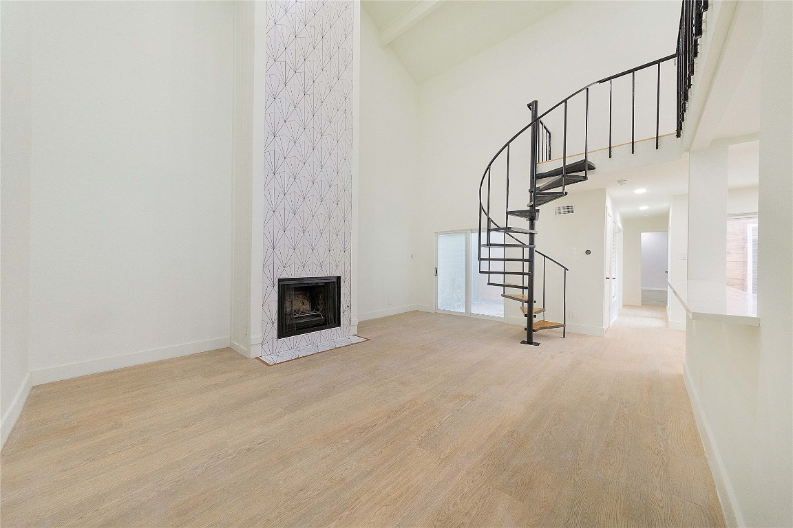 a view of a hallway with staircase