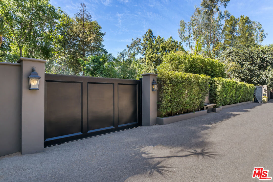 a backyard of a house with yard and outdoor seating