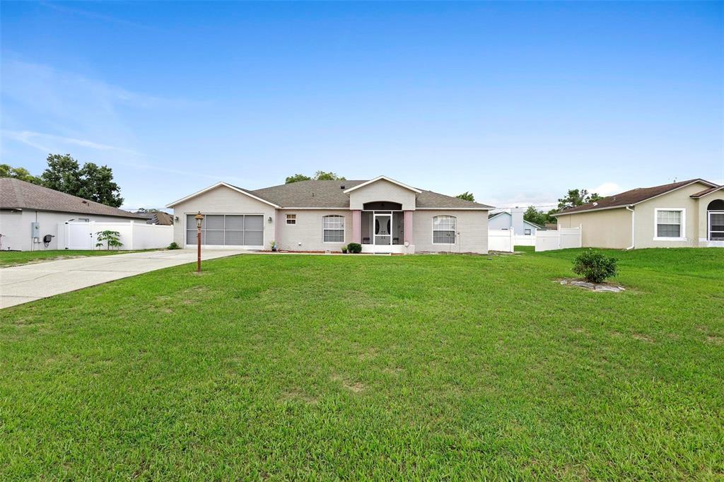 a view of a house with a big yard