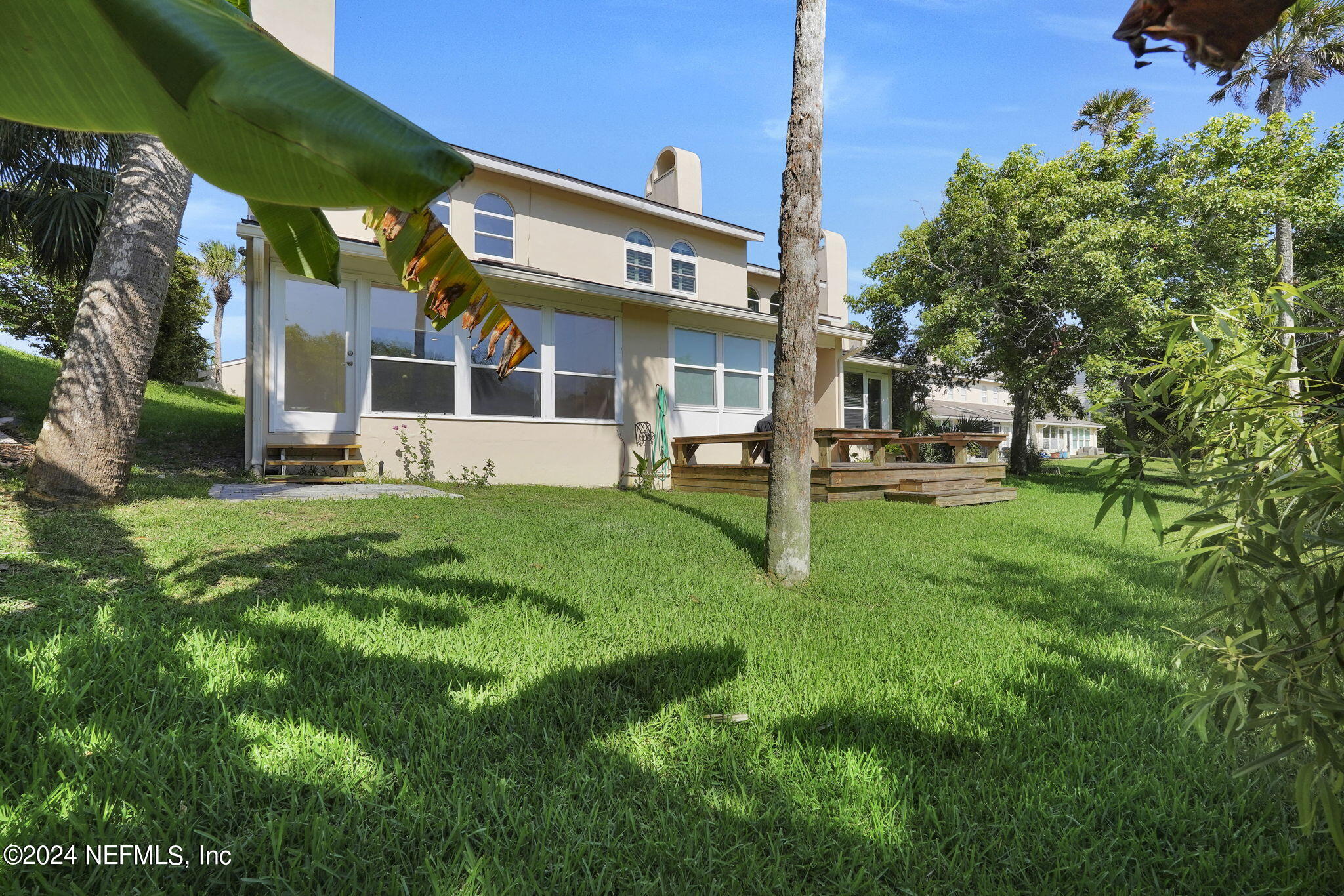 a front view of a house with a yard patio