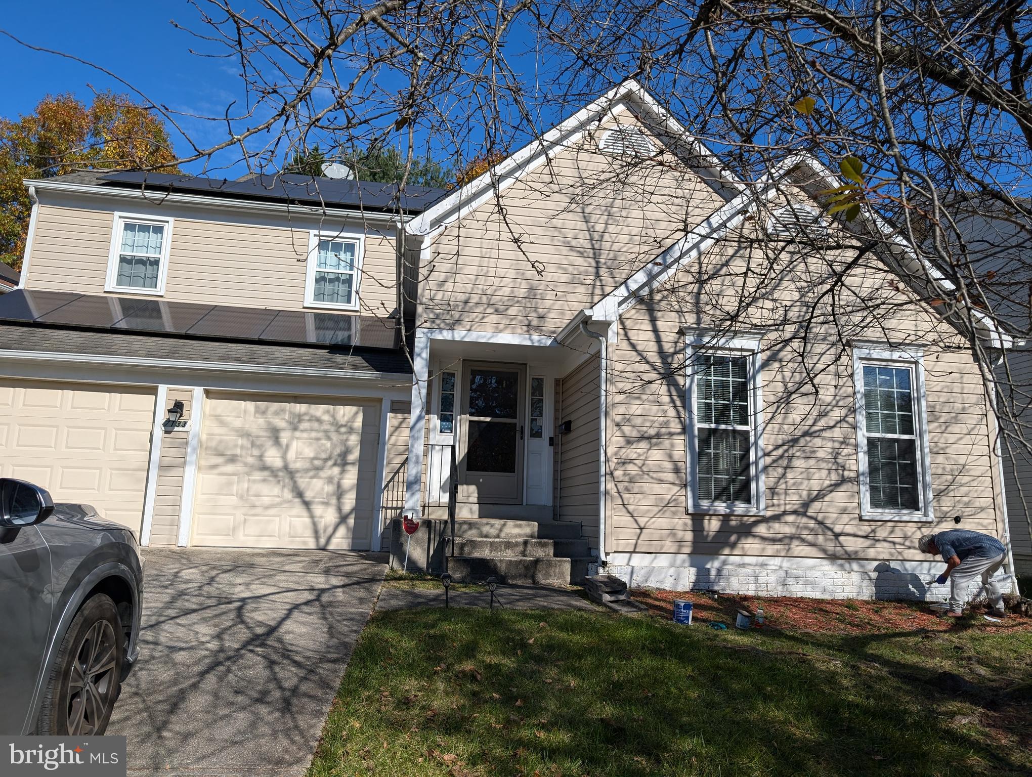 a view of a house with a backyard