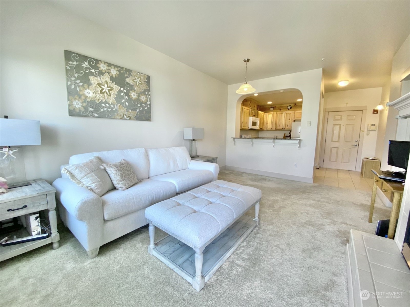 a living room with furniture and a flat screen tv