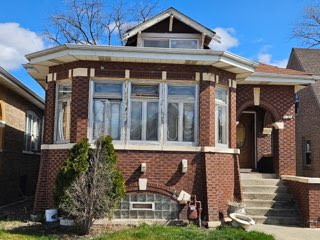 front view of a house with a small yard