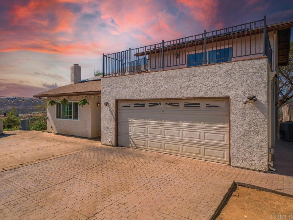 a front view of a house with a garage