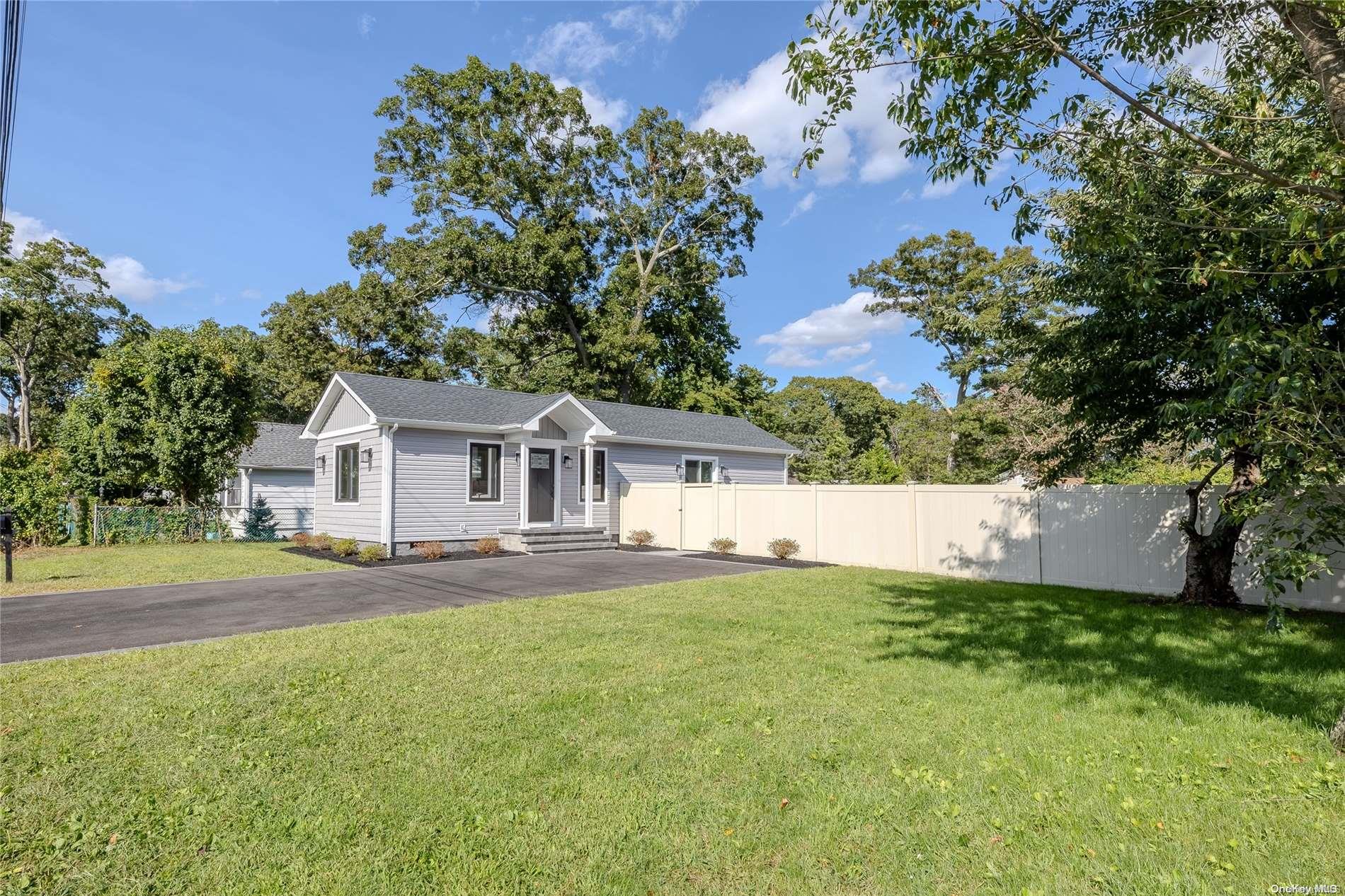 a view of house with a big yard