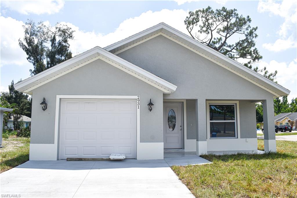 View of front of property featuring a garage