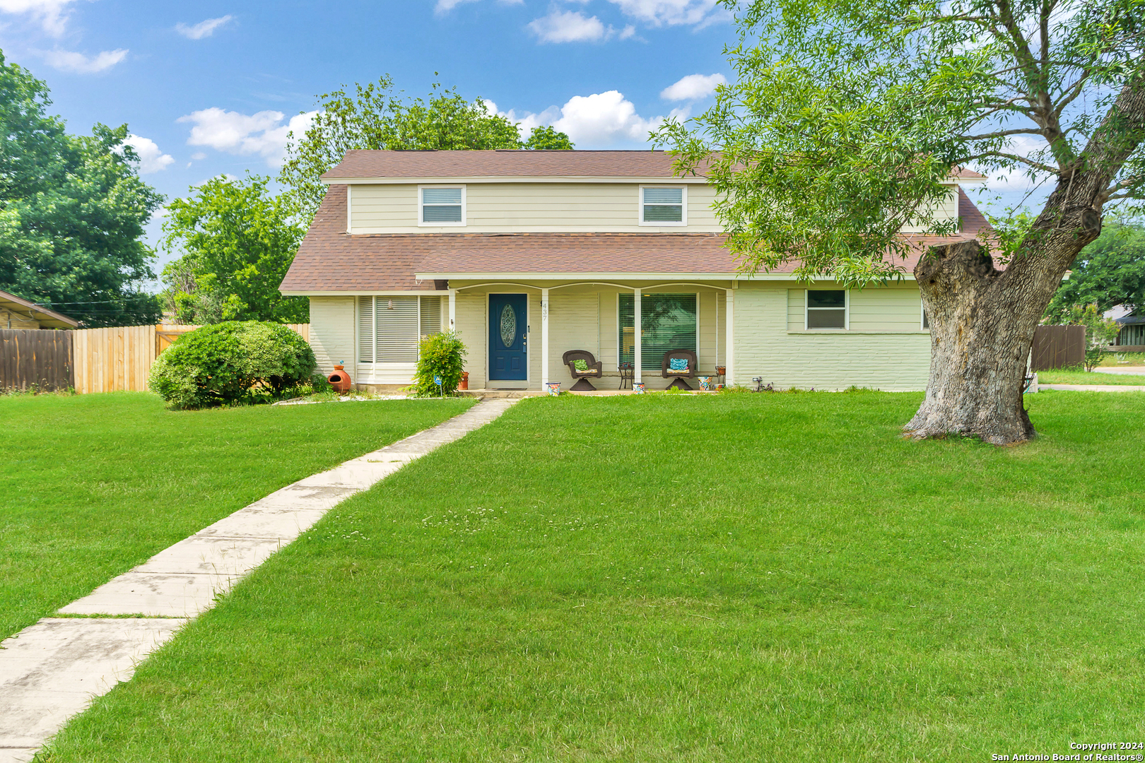 a front view of a house with a yard