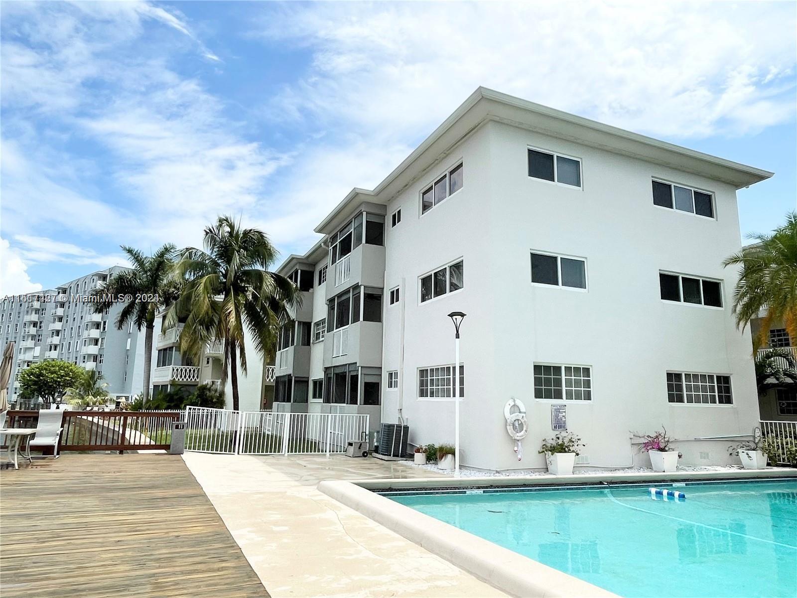 a front view of building with yard