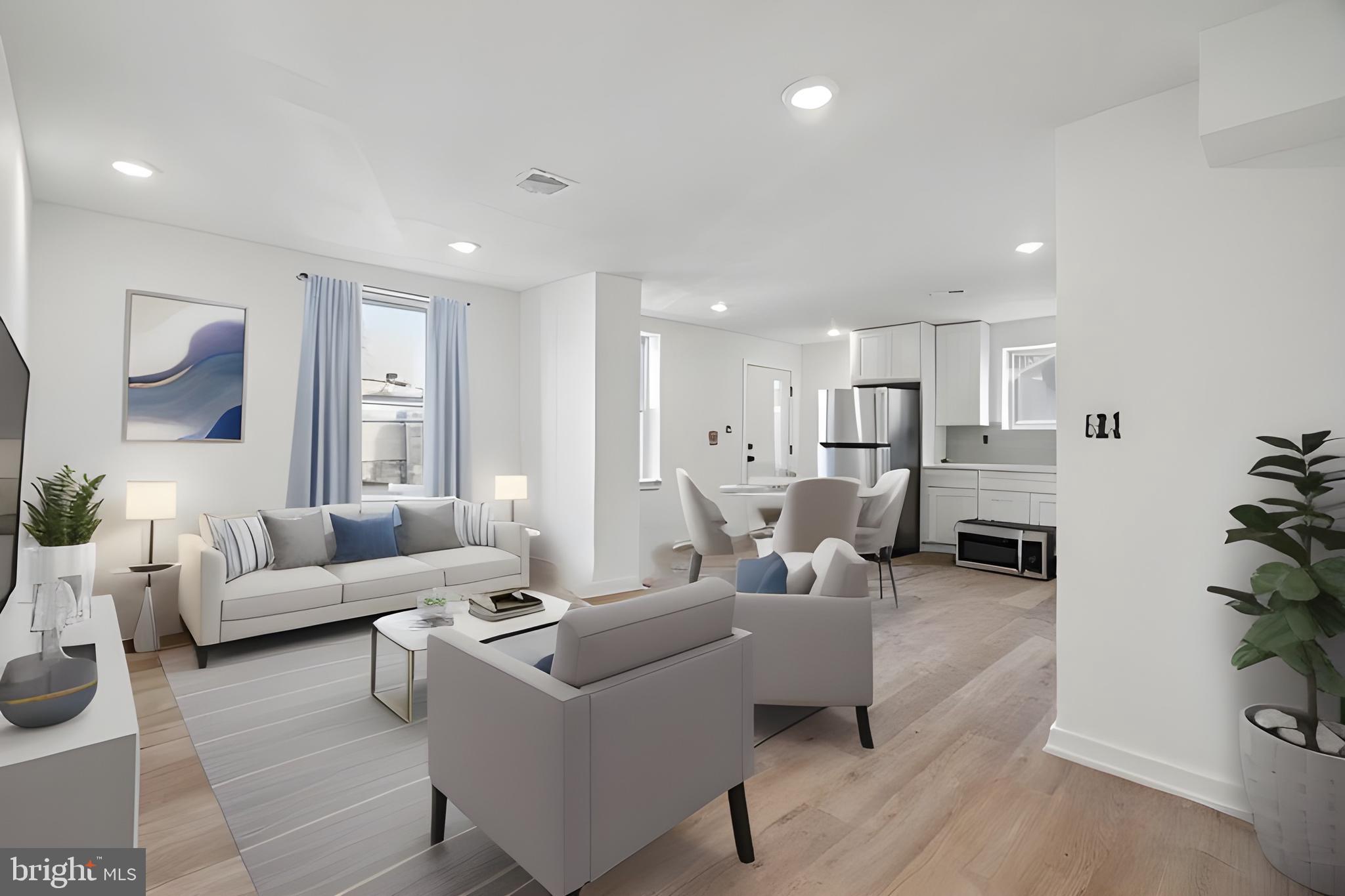 a living room with furniture white walls and white walls