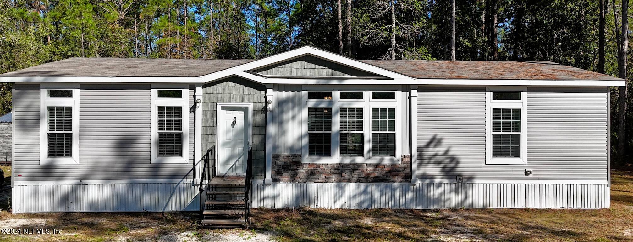 a front view of a house with yard