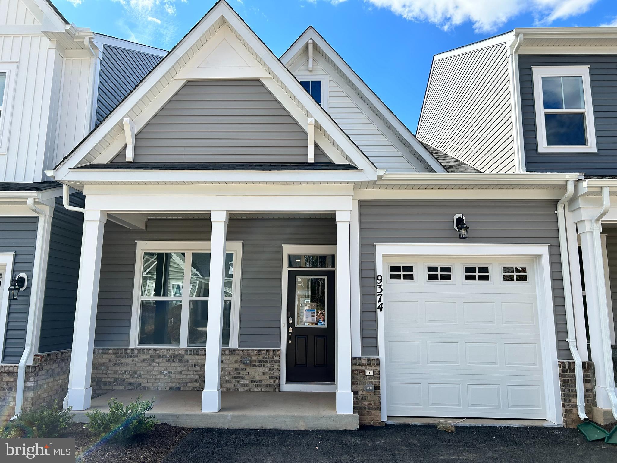 a front view of a house with a white door