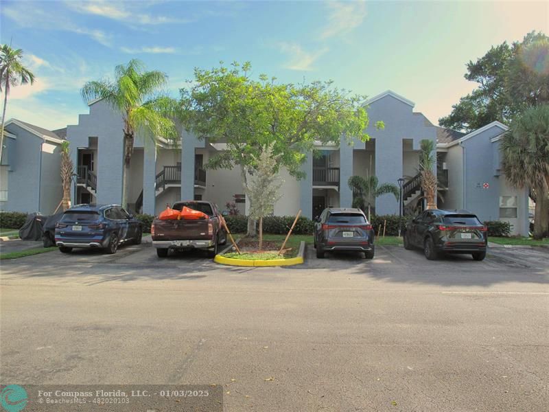 a view of a cars parked in front of a house