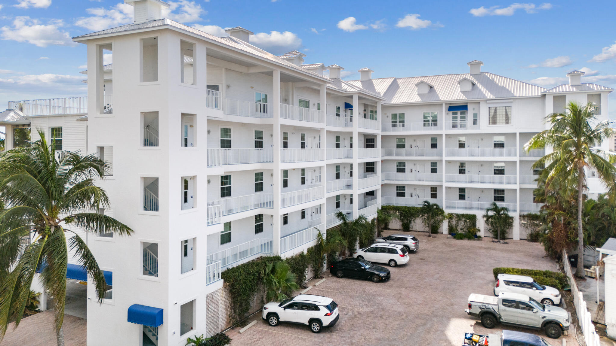 a front view of a building with parking