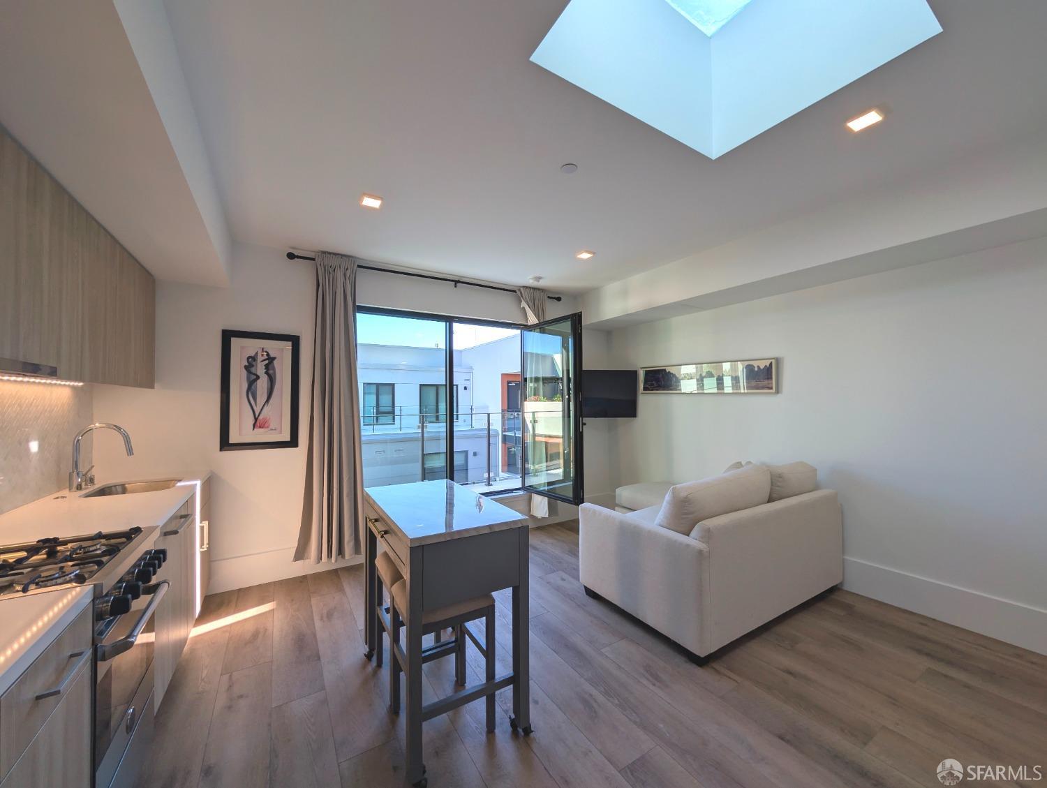 a living room with furniture and a stove top oven