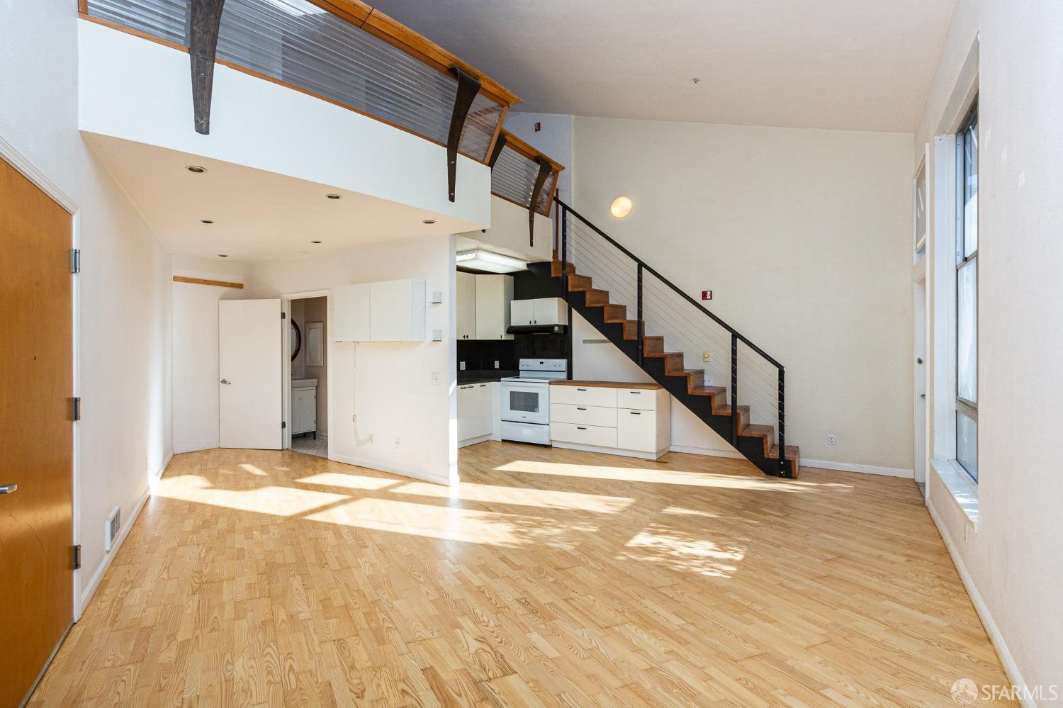 Cozy1 Bedroom loft in vibrant artist's community features wood floors, abundant natural light, and a private patio.