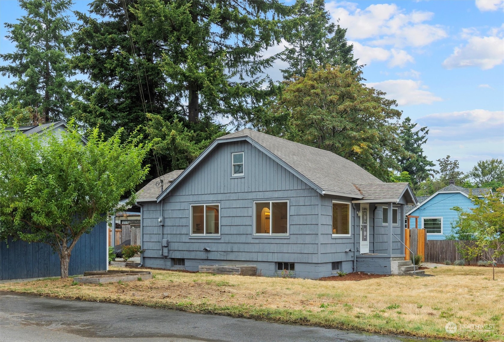 a front view of a house with a yard